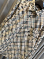 Burberry plaid button-up shirt with chest pocket and decorative icon stitching
