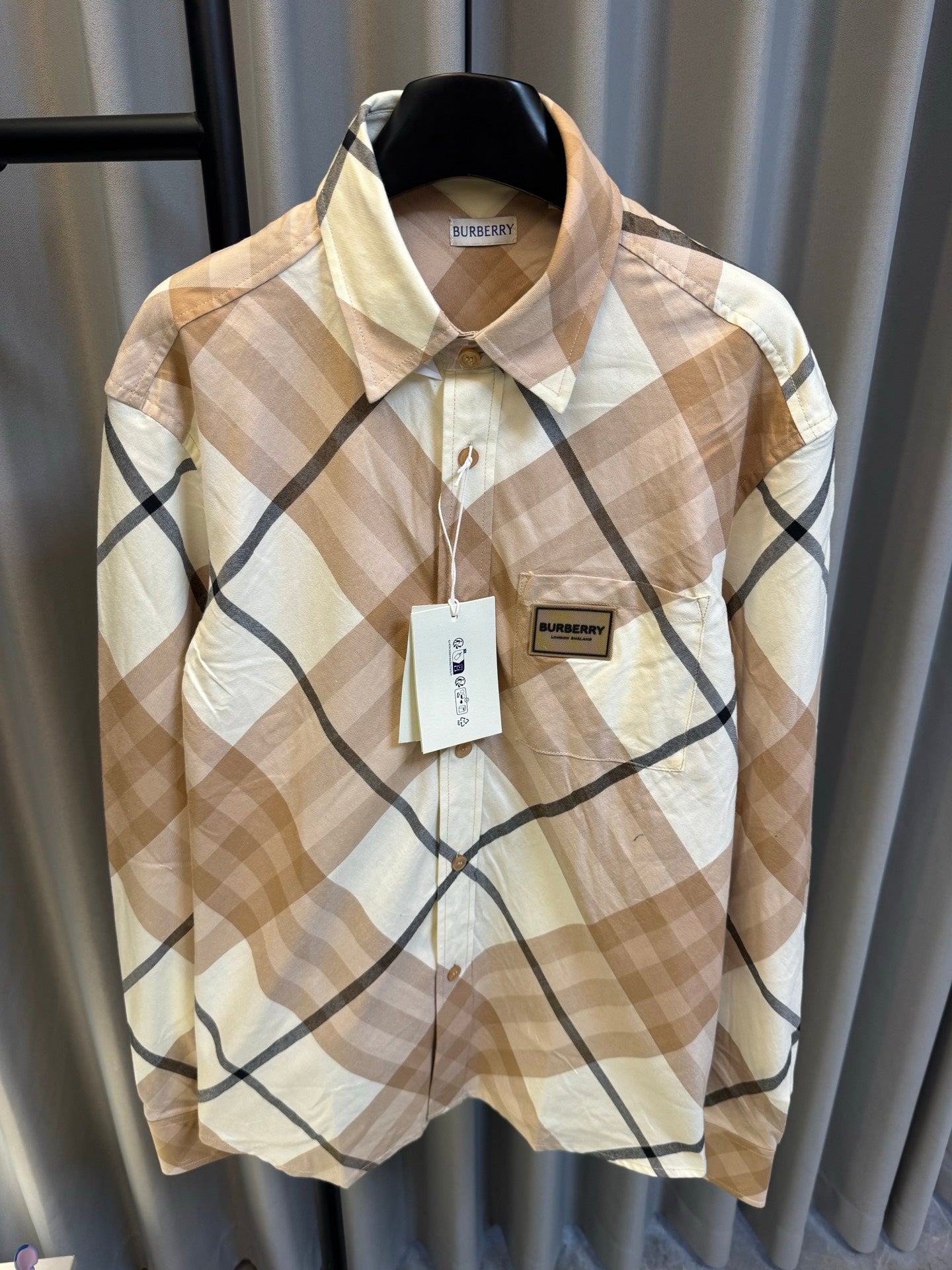 Burberry long-sleeve button-up shirt, beige and navy diamond plaid, with tags on hanger