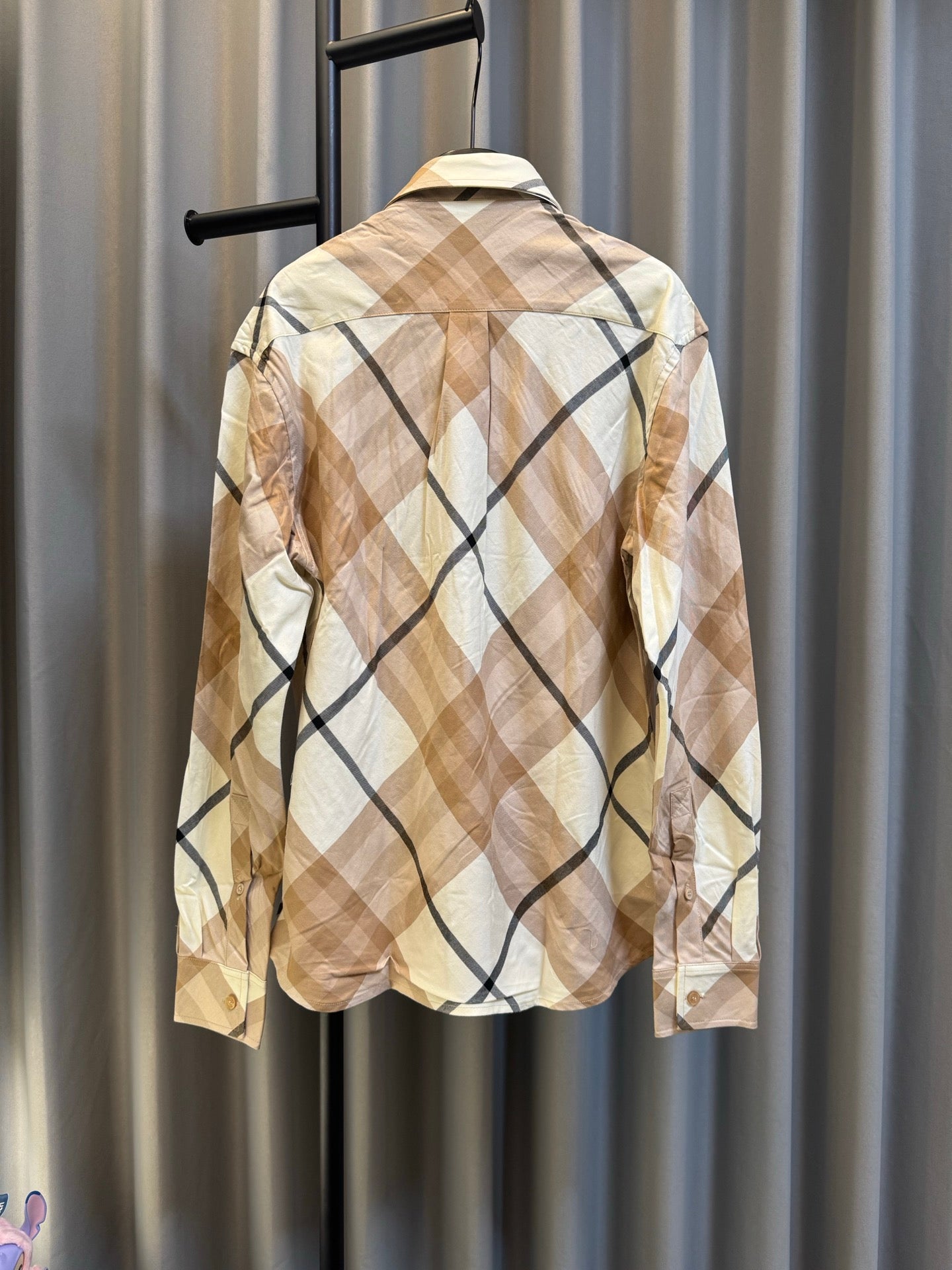 Burberry long-sleeve check shirt, beige with navy diamond plaid, back view on hanger