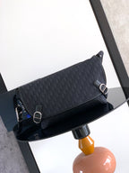 Dior shoulder bag in dark navy with logo pattern, flap and metal ring hardware