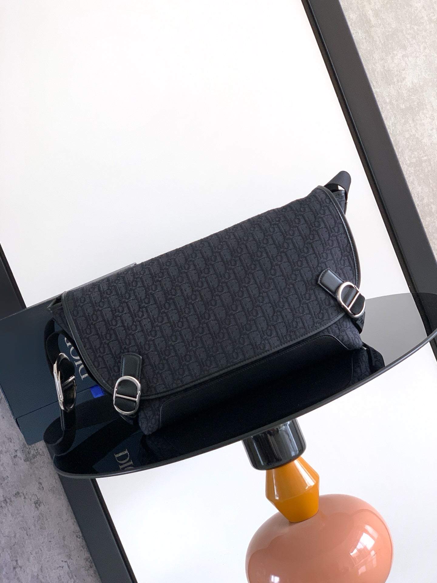 Dior shoulder bag in dark navy with logo pattern, flap and metal ring hardware