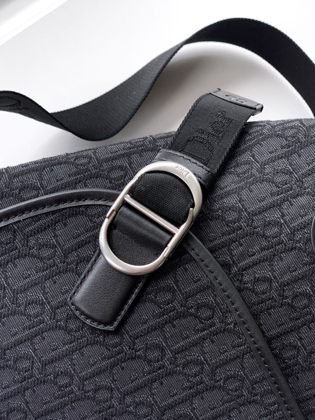 Dior bag strap and silver buckle on dark navy monogram jacquard