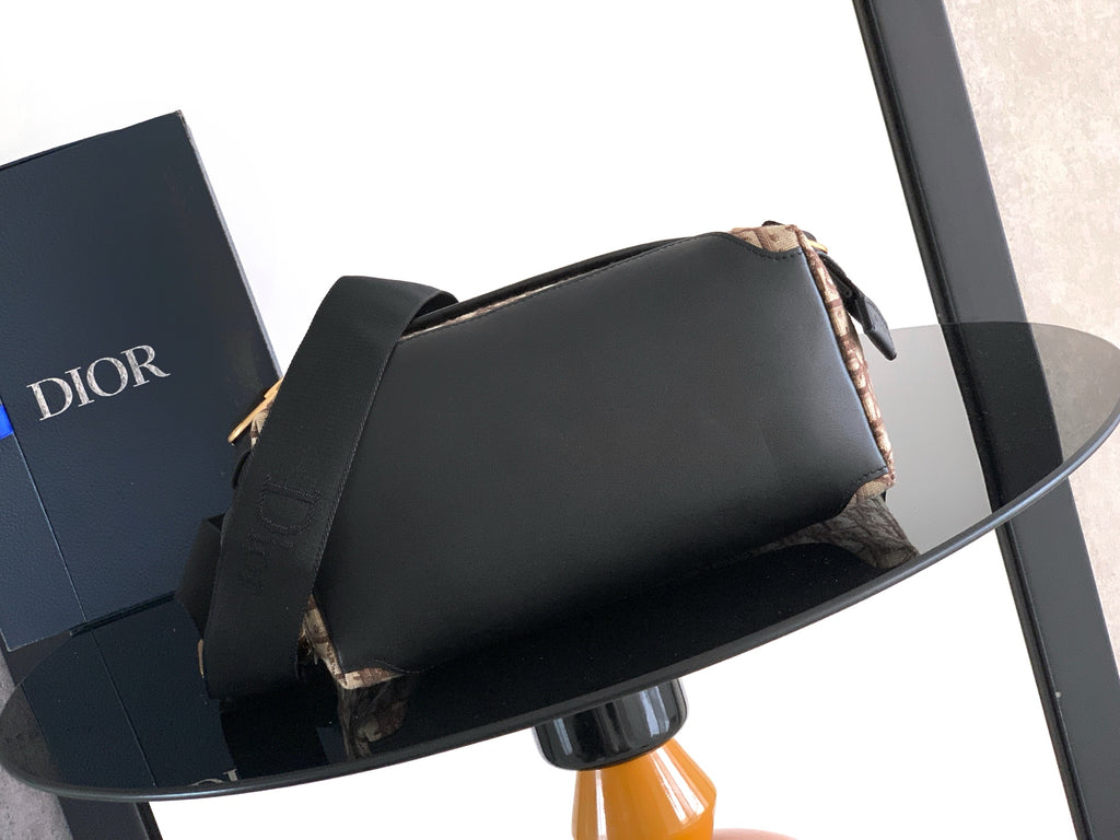 Dior shoulder bag, black top flap with beige patterned side and black crossbody strap
