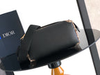 Dior shoulder bag, black top flap with beige patterned side and black crossbody strap