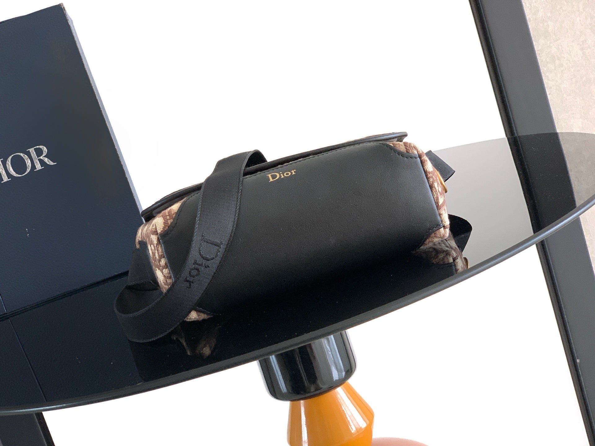Dior mini shoulder bag in black leather with top handle and strap
