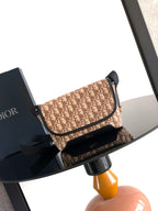 Dior small crossbody bag with beige monogram canvas and black leather trim