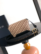 Dior crossbody bag beige monogram with gold O-ring and black strap