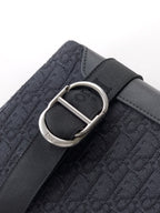 Dior monogram bag with silver D-ring buckle on shoulder strap, dark