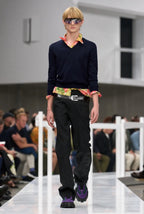 Black tailored pants with belt; straight legs and side pleats