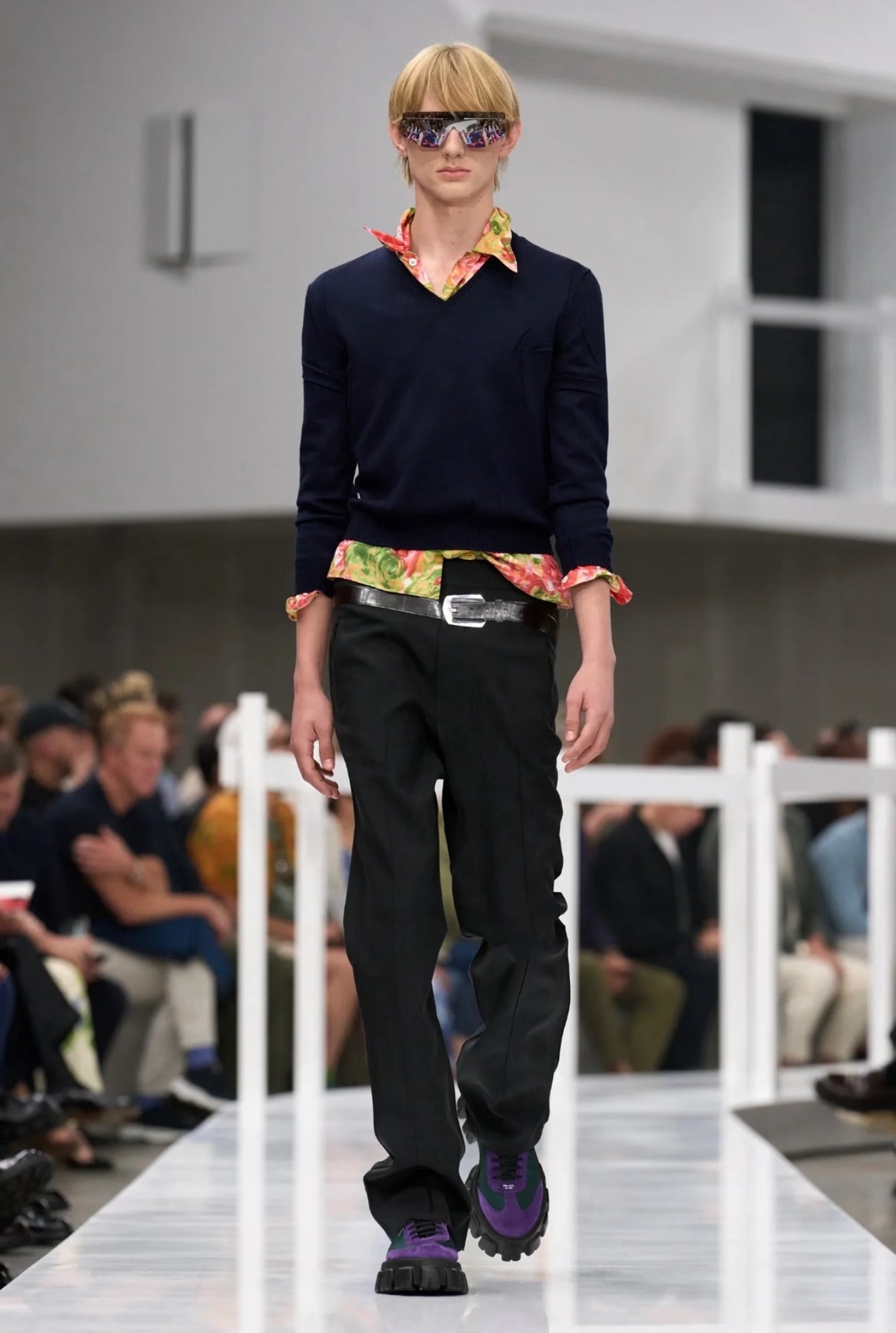Black tailored pants with belt; straight legs and side pleats