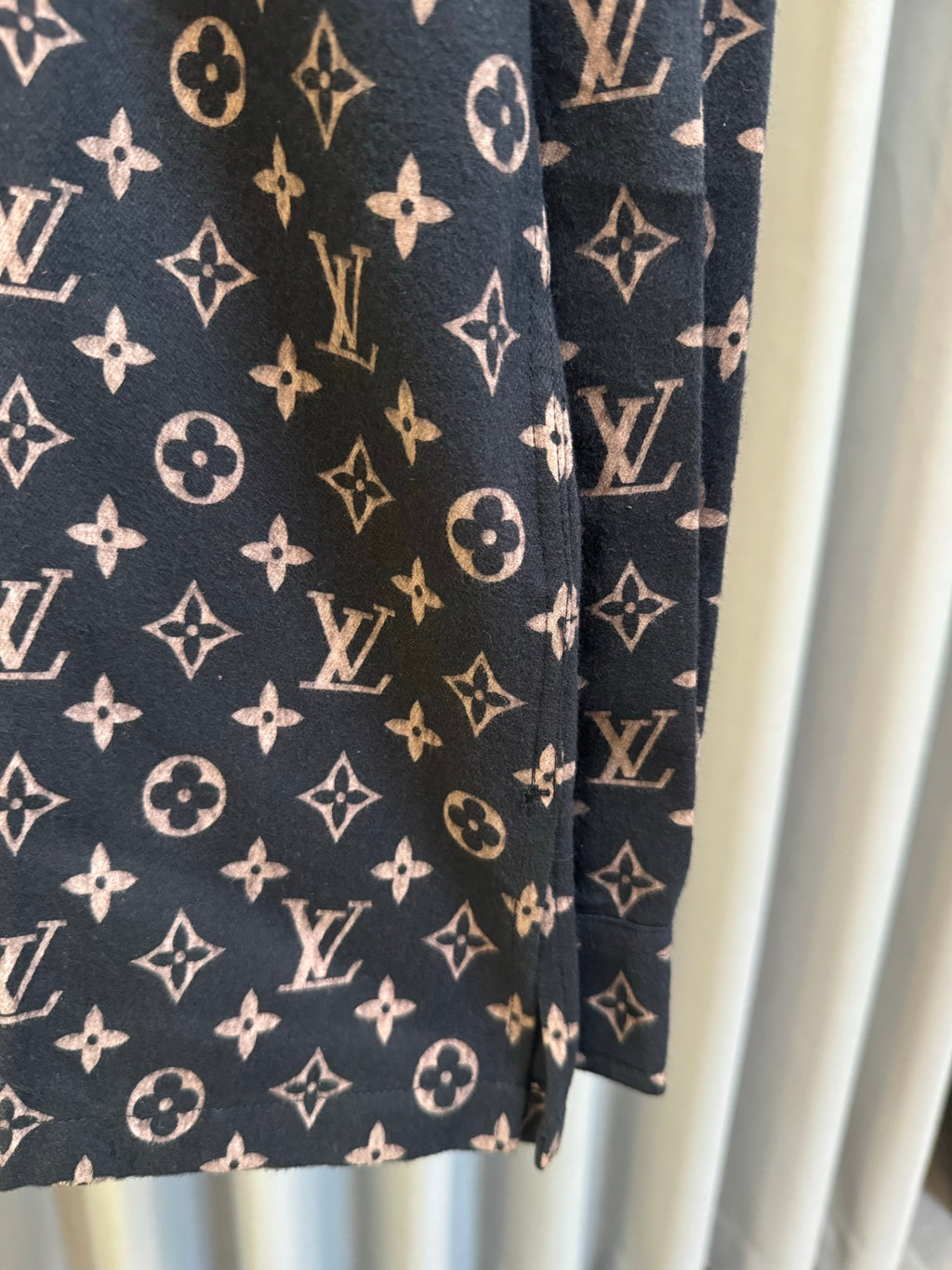 Long-sleeve jacket side view in dark navy with Louis Vuitton monogram print
