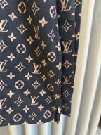 Long-sleeve jacket side view in dark navy with Louis Vuitton monogram print