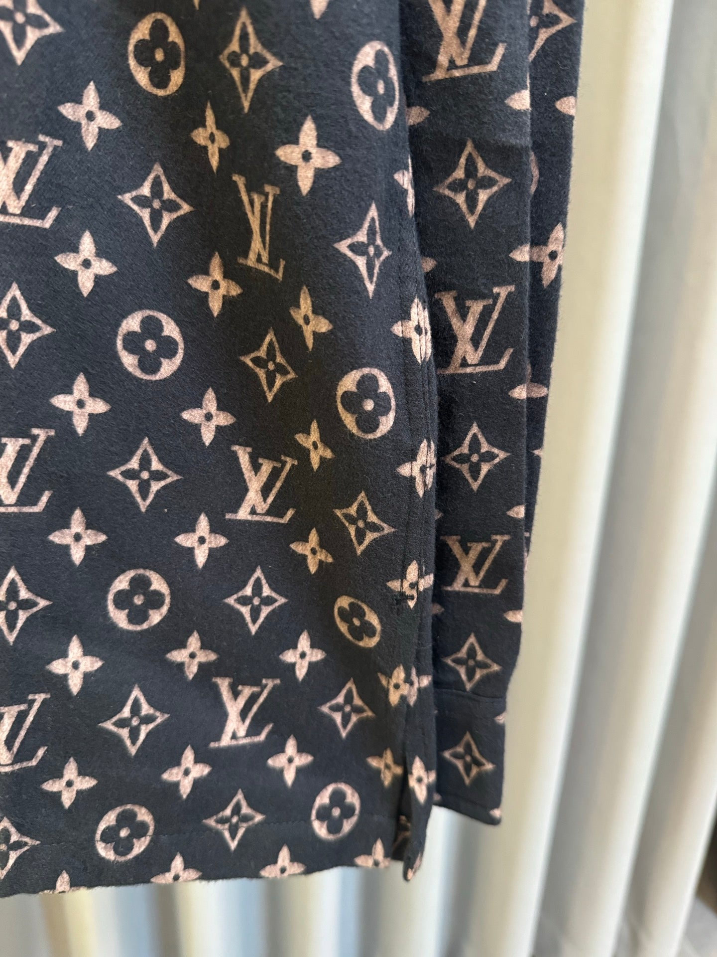Long-sleeve jacket side view in dark navy with Louis Vuitton monogram print