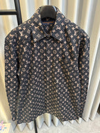 Long-sleeve jacket front close-up in dark navy with Louis Vuitton monogram print, collar