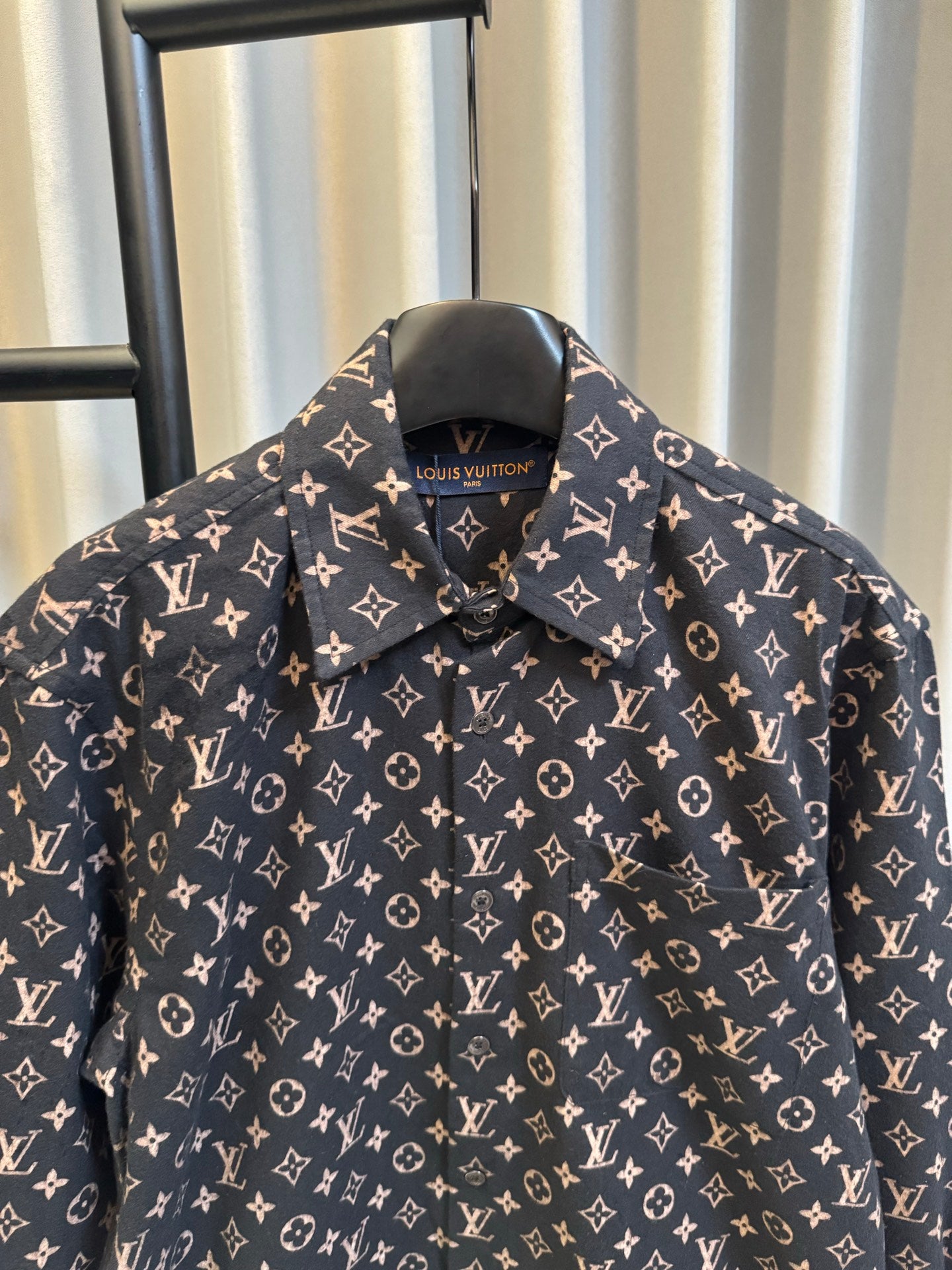 Long-sleeve jacket upper front in dark navy with Louis Vuitton monogram print, pointed collar