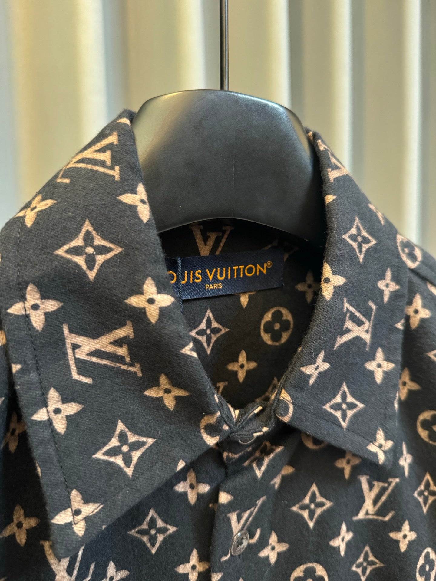Long-sleeve jacket neckline and inner label area in dark navy with Louis Vuitton monogram print