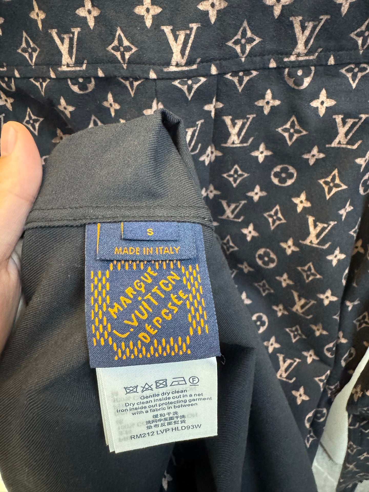 Long-sleeve jacket interior label area showing size S and Made in Italy on navy monogram