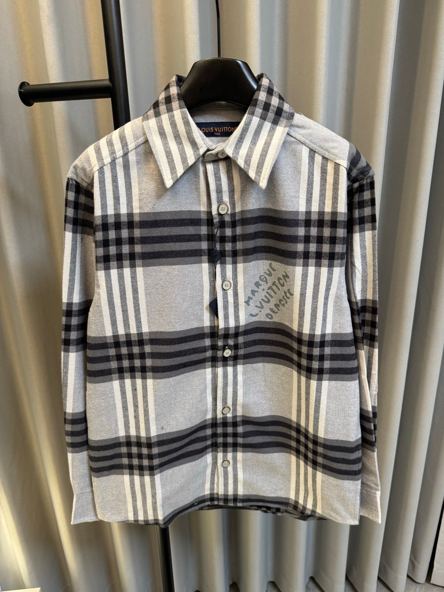 Louis Vuitton plaid button-up shirt with spread collar and chest logo detail