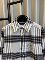 Louis Vuitton plaid button-up shirt with collar and chest logo graphic