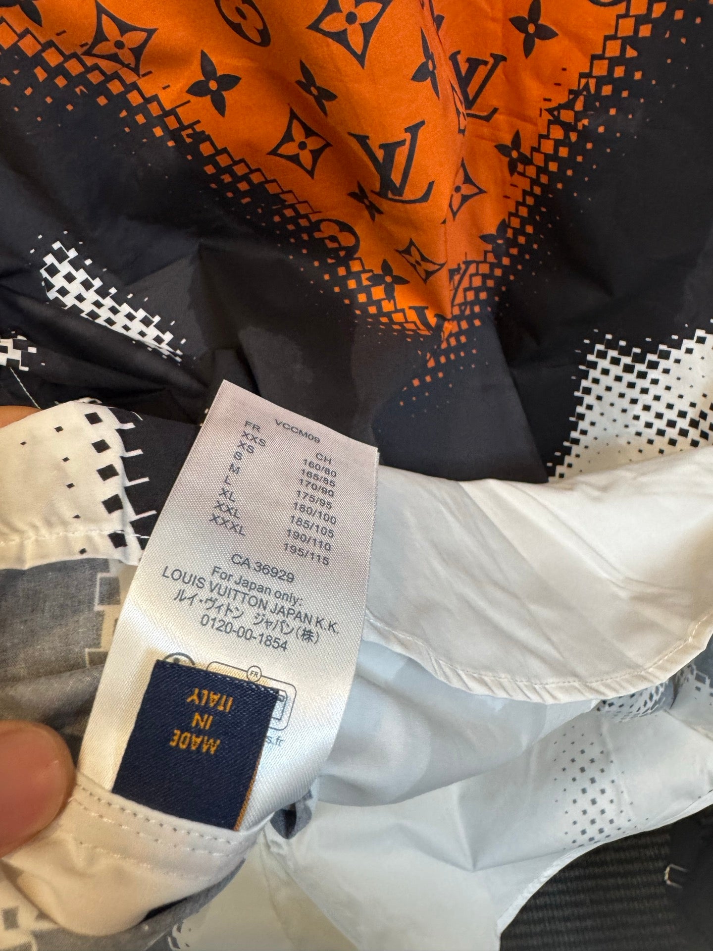 Louis Vuitton shirt with size tag and inner label on white interior fabric