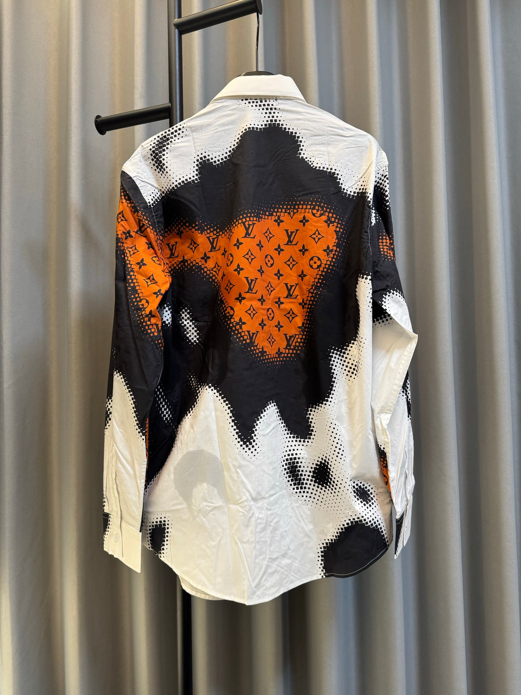 Louis Vuitton long-sleeve shirt with black-and-white camo print and orange detail, back view