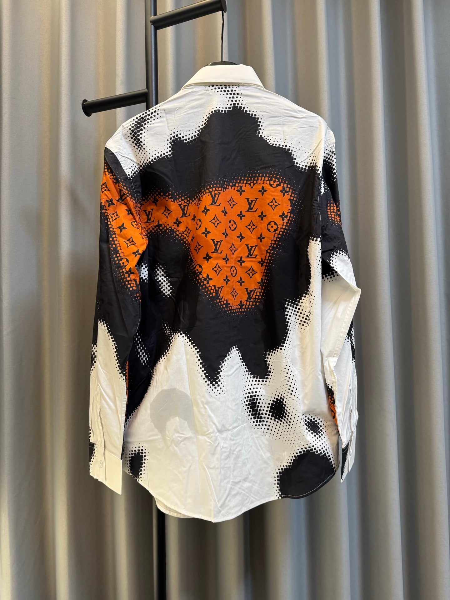 Louis Vuitton long-sleeve shirt with black-and-white camo print and orange detail, back view
