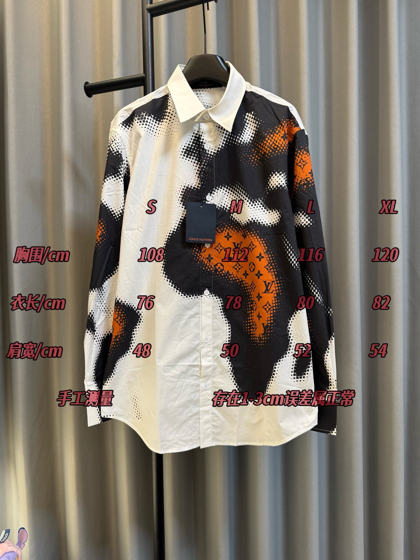 Louis Vuitton long-sleeve shirt with black, white, and orange camo print, button placket