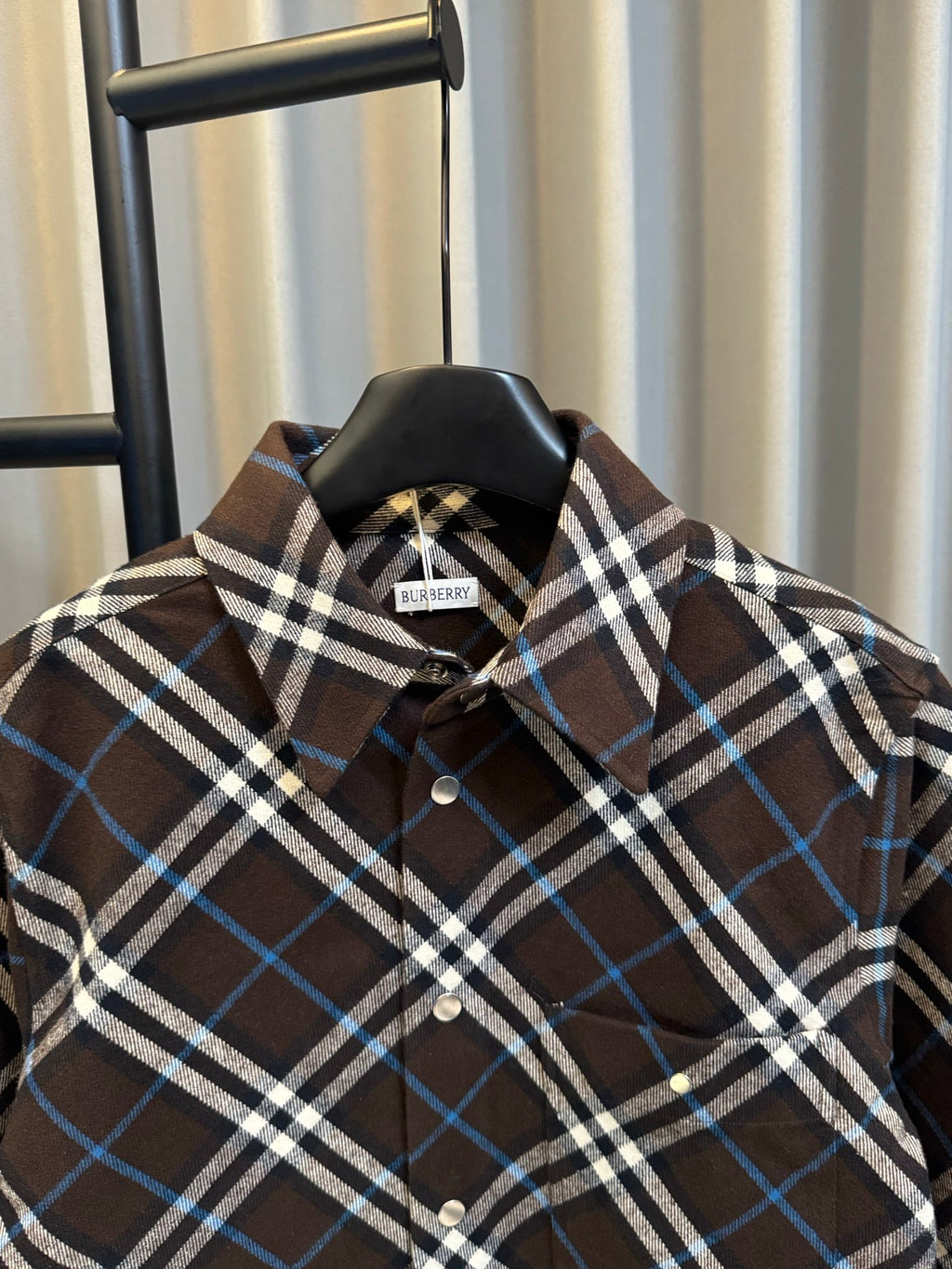 Burberry plaid button-up shirt collar and placket, dark brown with blue and white checks