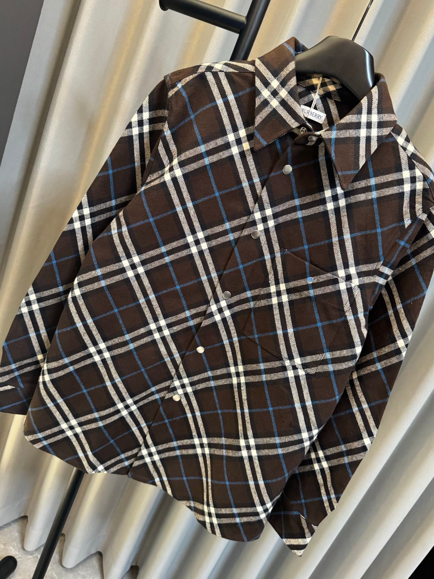 Burberry plaid long-sleeve shirt close-up, dark brown, blue and white check pattern