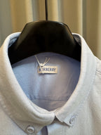 Light blue Burberry shirt neckline with inner neck label and buttoned collar