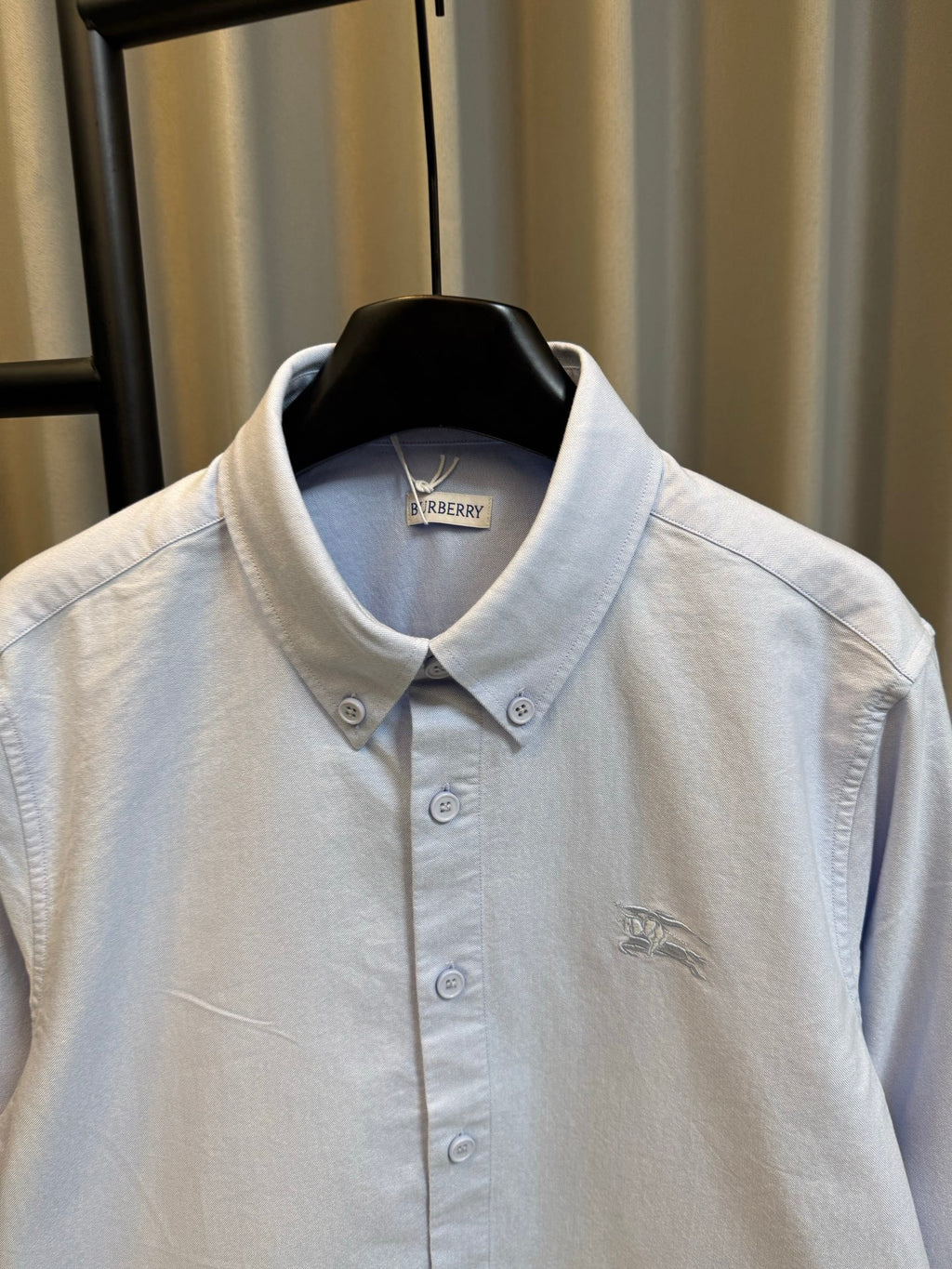 Light blue Burberry button-up shirt close-up of collar and front button area