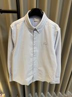 Light blue Burberry button-up shirt with pointed collar and front button placket
