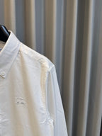 Burberry long-sleeve button-up shirt, white, side view with embroidered chest detail