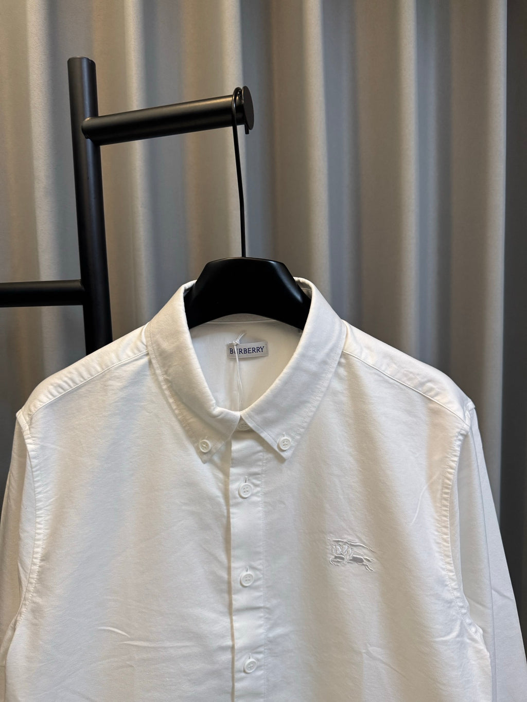 Burberry long-sleeve button-up shirt, white, upper front view with collar and placket