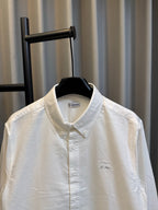 Burberry long-sleeve button-up shirt, white, upper front view with collar and placket