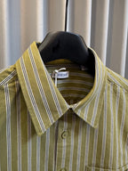 Green striped button-up shirt with point collar and button detail