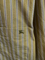 Green and white striped shirt sleeve with stitched cuff detail