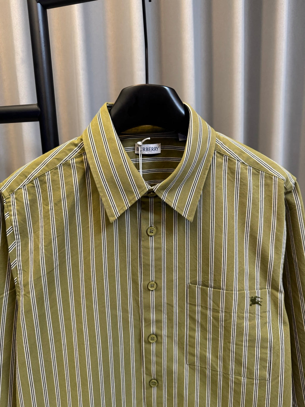 Green striped button-up shirt with Burberry neck label and point collar