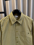 Green striped button-up shirt with Burberry neck label and point collar
