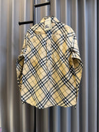 Burberry plaid button-up shirt, tan base with navy check pattern and long sleeves