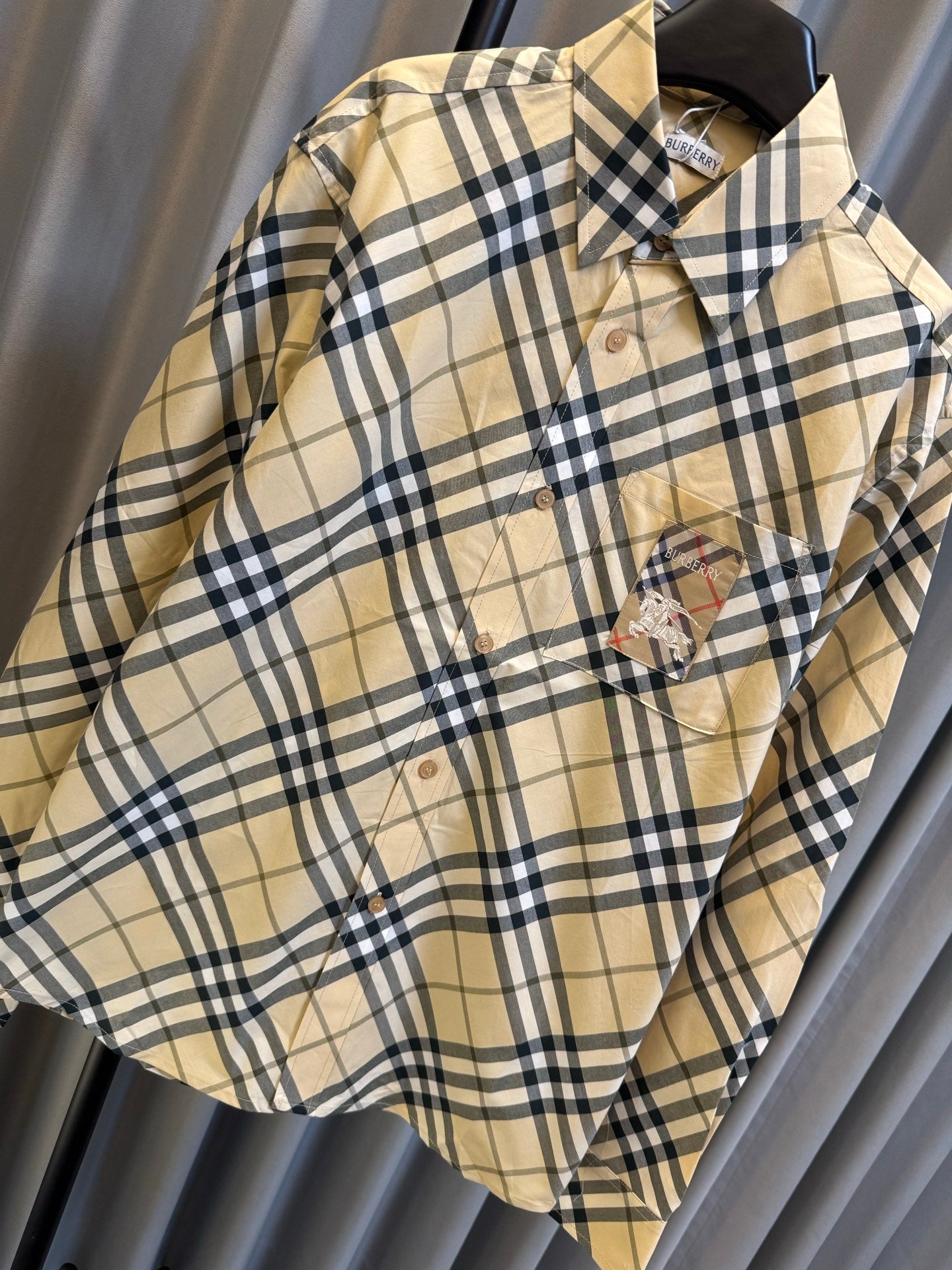 Burberry plaid button-up shirt in tan with navy checks, featuring logo embroidery on chest