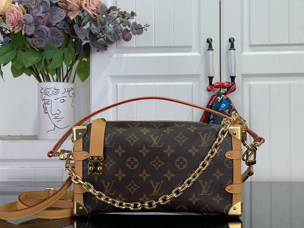 Louis Vuitton monogram handbag with tan leather trim and gold chain shoulder strap