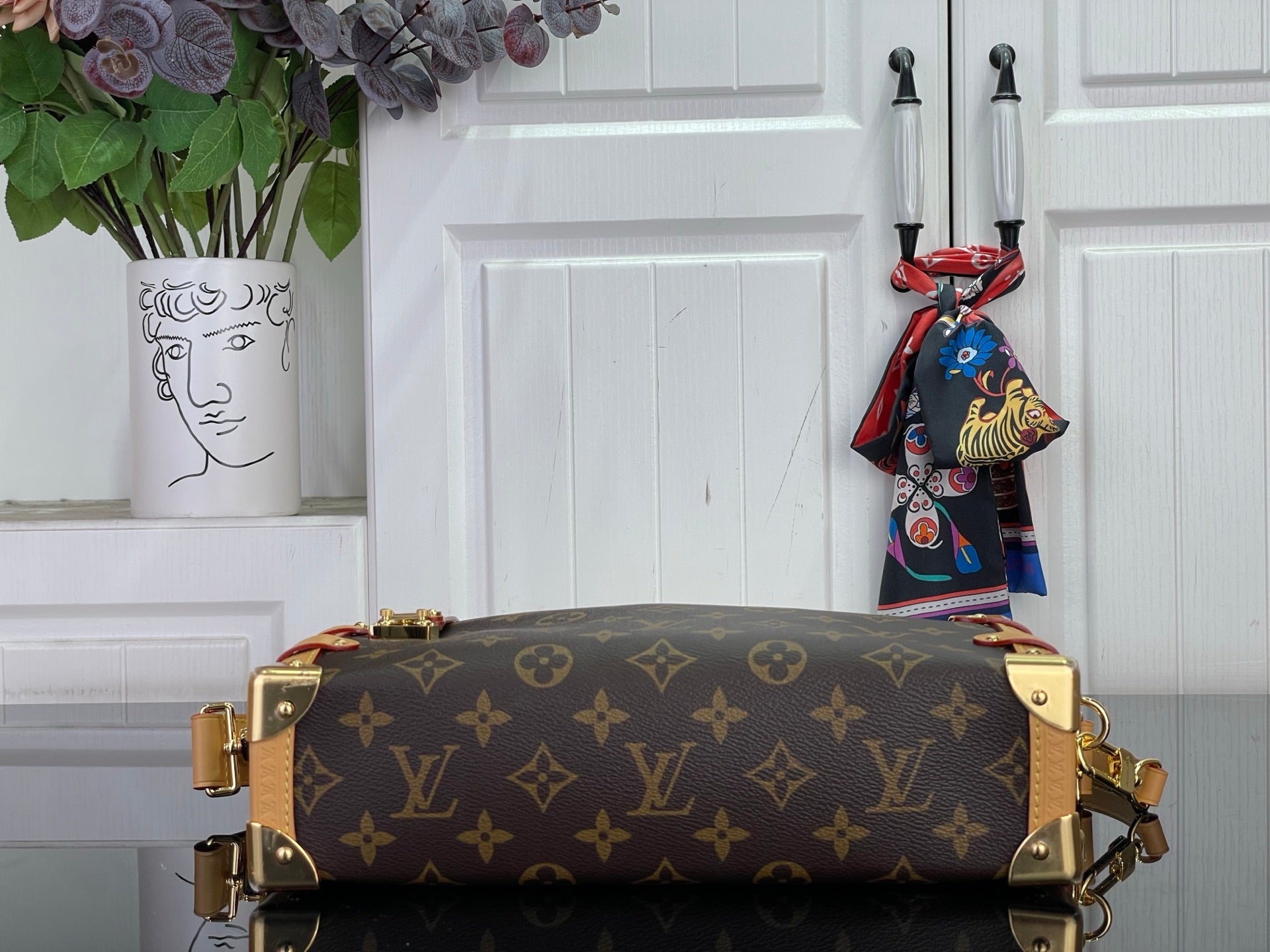 Louis Vuitton monogram handbag with tan leather trim and gold top handles