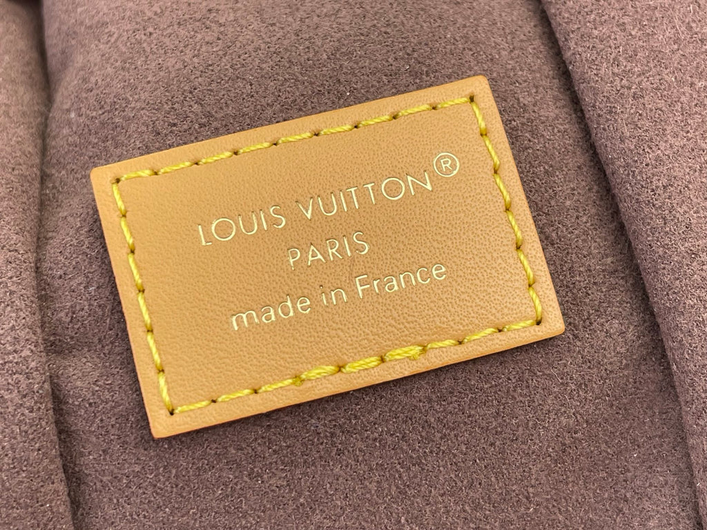 Louis Vuitton bag beige leather label with stitching and text, made in France