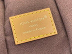 Louis Vuitton bag beige leather label with stitching and text, made in France