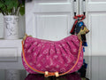 Louis Vuitton pink monogram hobo bag with curved top and gold-tone shoulder strap.