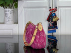 Louis Vuitton pink monogram bag with adjustable shoulder strap and gold-tone hardware.