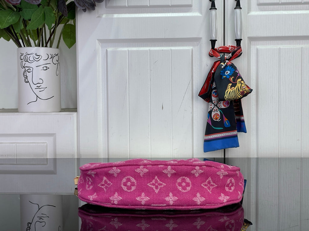Louis Vuitton pink monogram bag with fabric top edge and gold hardware detail.