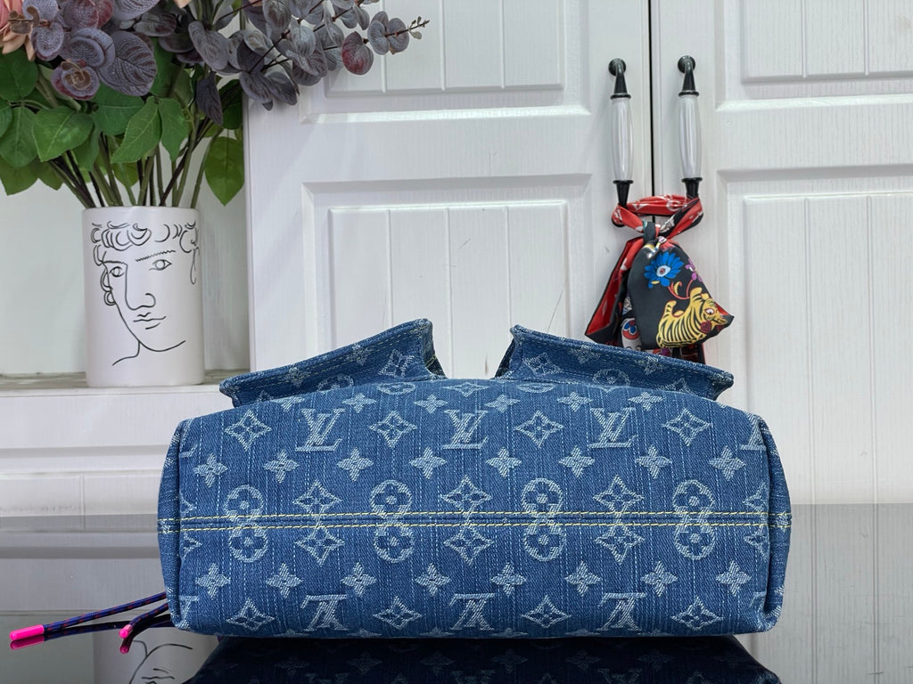 Blue monogram denim handbag with top flap and structured front panel