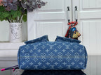 Blue monogram denim handbag with top flap and structured front panel